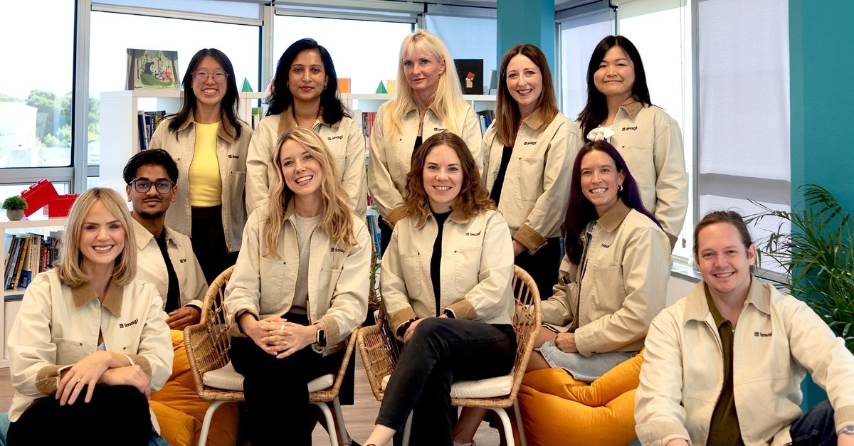 The imagi team in matching imagi jackets in their office
