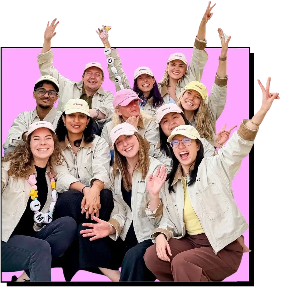 A group of people in imagi caps and jackets cheering together